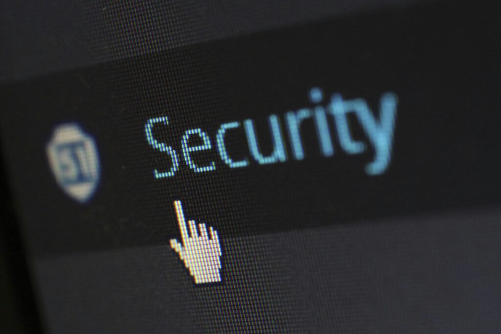SECURITY WARNING Close-up view of a mouse cursor over digital security text on display.